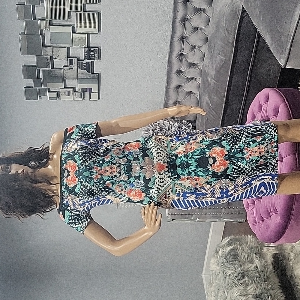 Patterned dress. Midi length. New without tags. On or off shoulder design.